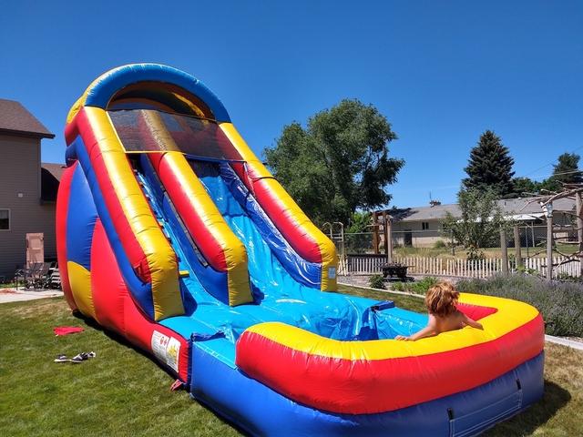 An inflatable water slide